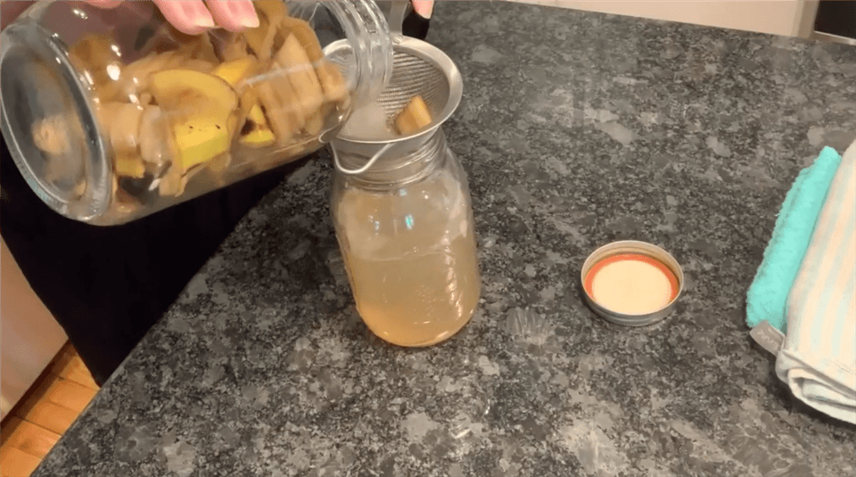 Strain the Liquid to Remove the Banana Peel Pieces